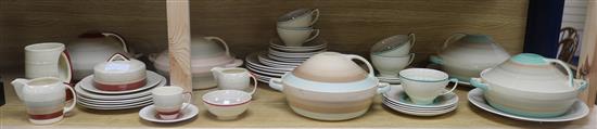 A large quantity of Susie Cooper striped dinner wares in various colours
